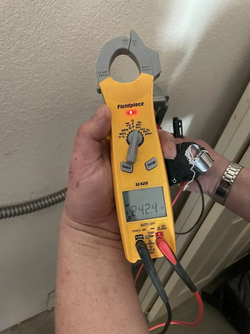 Voltage testing with clamp meter during Outlet Installation in Deltona